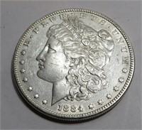 1884 AU grade Morgan Silver Dollar