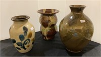 Lot of three glazed pottery vases - largest being