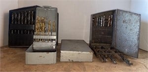 3 Drill bit boxes with an assortment of bits.