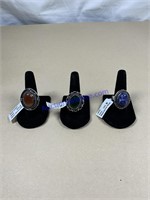 Three rings, assorted sizes, assorted stones,