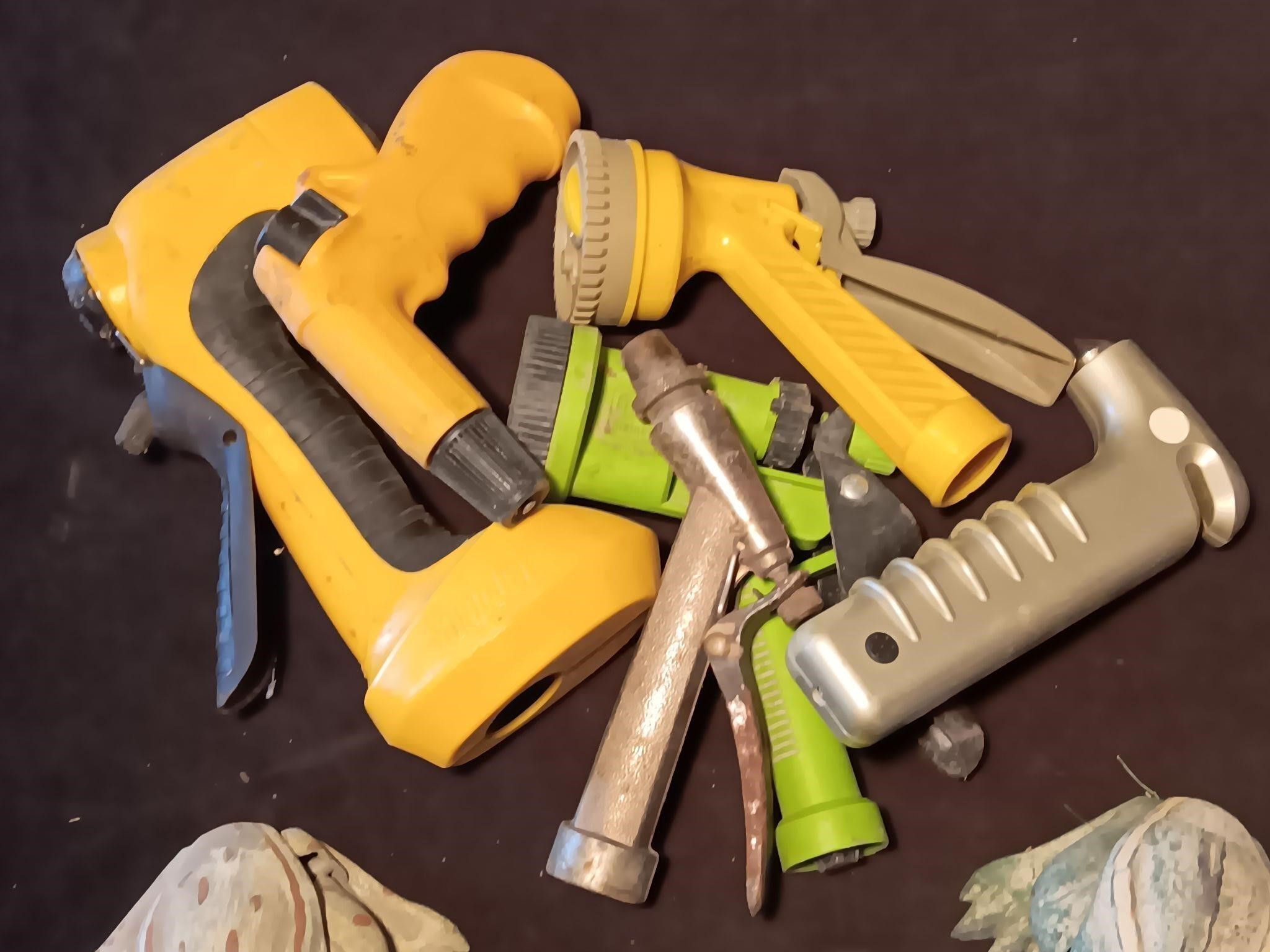 Large Lot Of Garden Hose Nozzles And Garden Bugs.