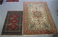 Two hand made wool rugs