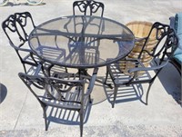 GLASS TOP WROUGHT IRON TABLE AND 4 CHAIRS