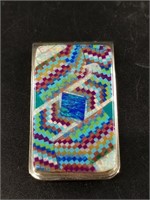 Money clip with a bright mosaic pattern on front