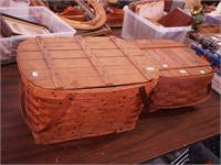 Two lidded wood picnic baskets, both with