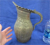 antique handmade metal pitcher