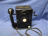 vintage hand crank telephone .