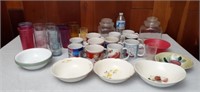 Plastic cups, coffee cups, clear glass canisters,