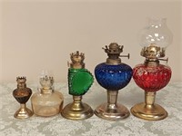 5 COLOURED GLASS OIL LAMPS TALLEST IS 9.75"