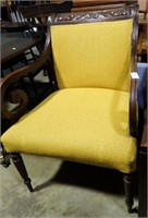 YELLOW UPHOLSTERED CARVED BACK CHAIR
