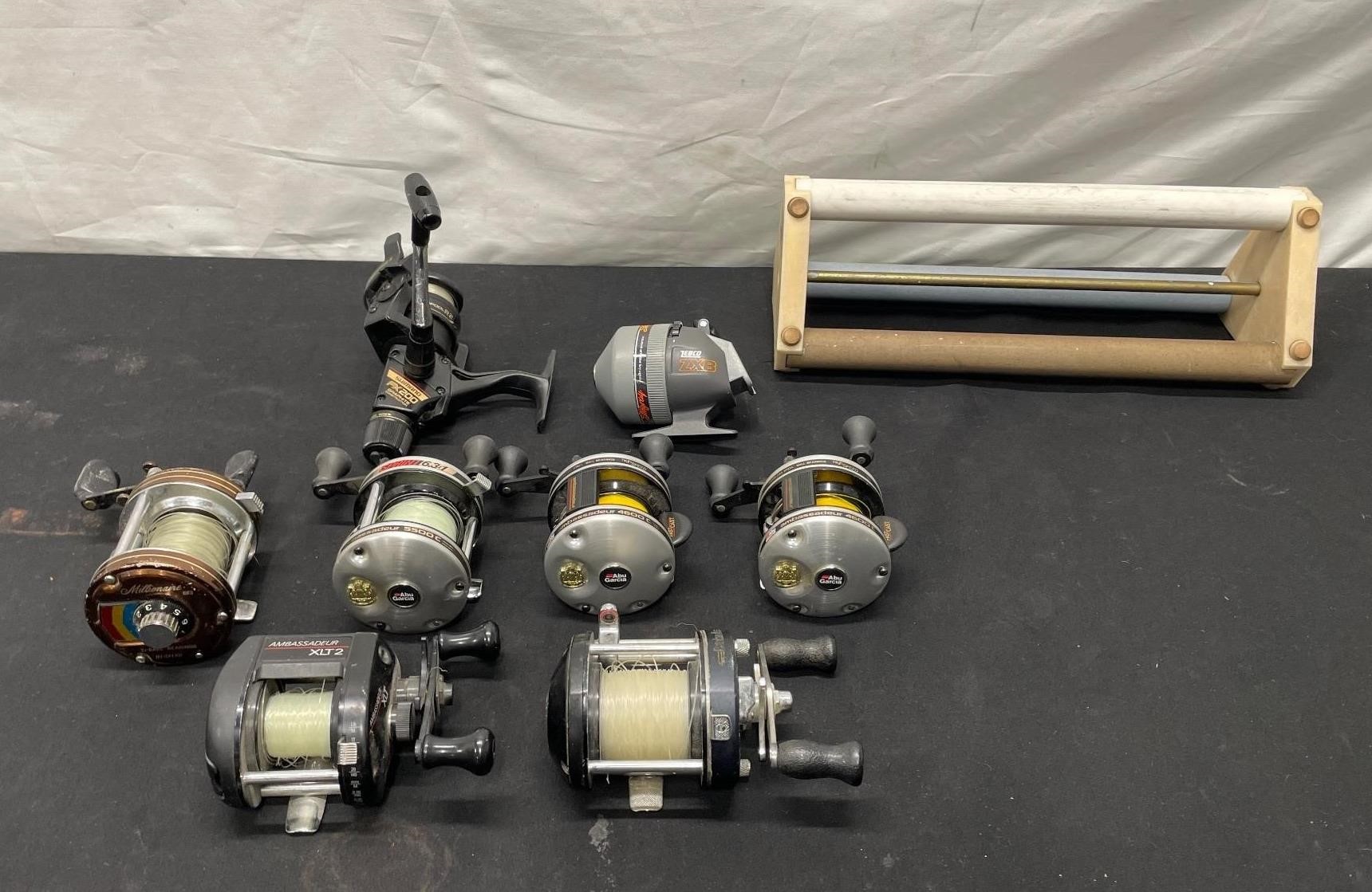 8 Fishing Reels And Knife Sharpener