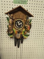 Cuckoo clock with weights and pendulum