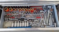 Collection of socket wrenches and socket bits