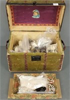 Antique doll trunk with many pairs of doll shoes,