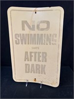 No Swimming Suits After Dark Sign