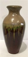 Decorative pottery vase measuring 13 inches tall.