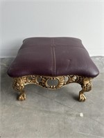 Small clawfoot footstool with maroon leather