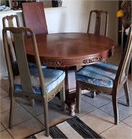 403 - 48 IN ROUND DINING ROOM TABLE AND 4 CHAIRS