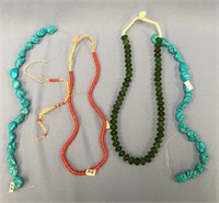 A lot with 3 trading bead necklaces and 2 strands