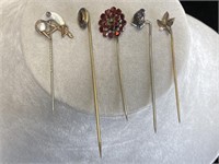 5 assorted vintage stick pins.