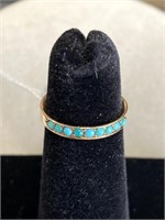 14kt yellow narrow band turquoise ring.