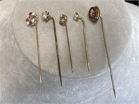 5 assorted vintage stick pins.