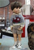 BOY DOLL IN STAND