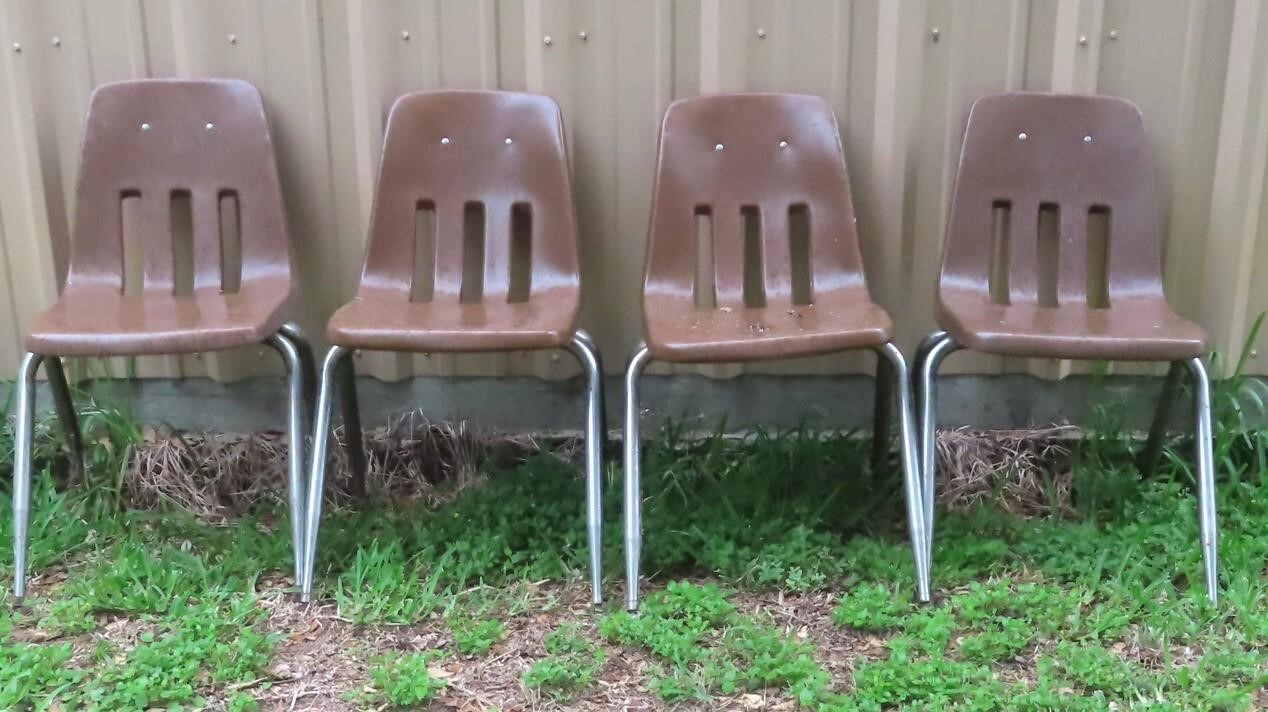 (4) brown plastic chairs