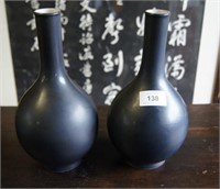 Pair of black glazed monochrome vases,