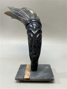 Tribal horn carving on Stone base