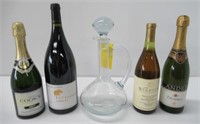 Wine and champagne bottles with crystal decanter