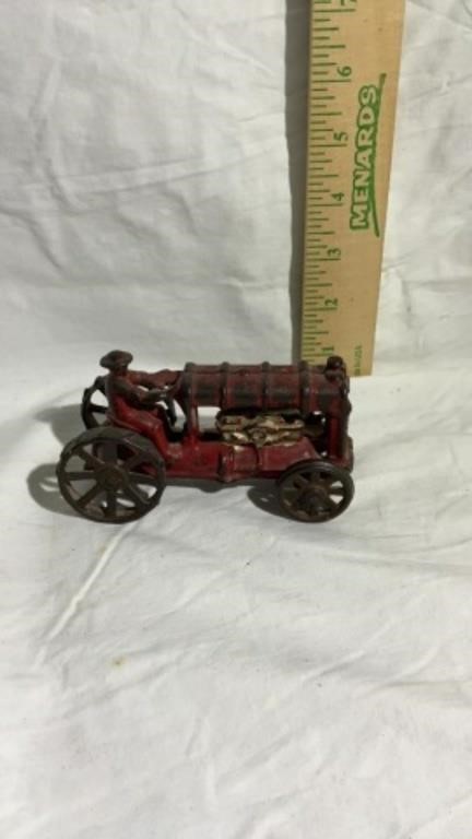 Vintage red cast iron tractor toy