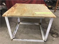Table welded from angle iron. Has plywood too.