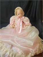 Porcelain baby doll 24 inches , dress lots bigger