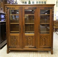 Neo Gothic Figural Carved Oak Bookcase.