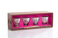 SET OF FOUR CHINESE FAMILLE ROSE PORCELAIN CUPS