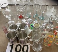 Wine glasses, metal mugs, drinking glasses and