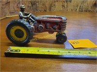 Red Toy Tractor and Man