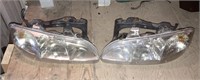 96-98 Pontiac grand am head light assembly (set)