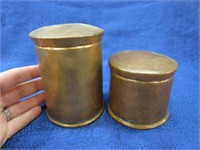 2 smaller copper canisters