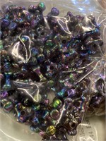 Two boxes of 10 mm propeller beads. Oil black