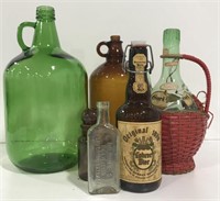 Various vintage decanters and glass bottles