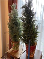 2 Christmas trees in metal buckets