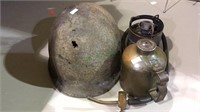 Metal military helmet, brass burner with hose,