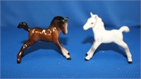 Two Beswick horses, white one has leg repair,