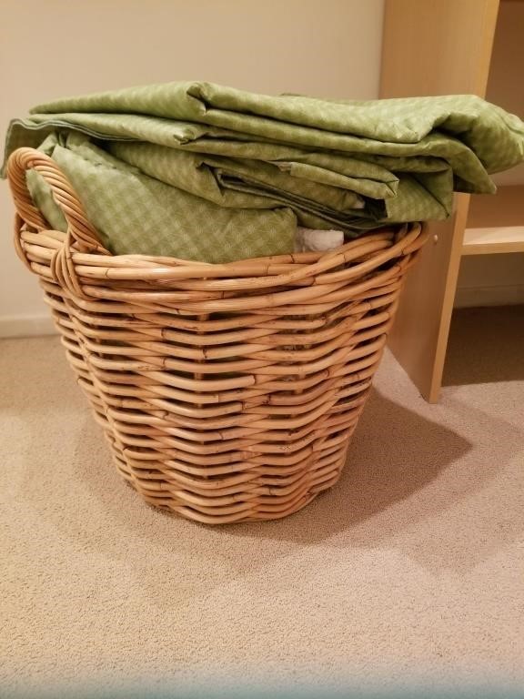 Rattan basket filled with table linens and