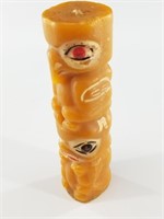 Totem pole themed candle with significant wear, 7"