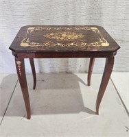 Small Ornate Table 16D×22T×23W. Has a chip mid