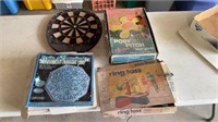 Dartboard, lawn games, and steppingstone kit