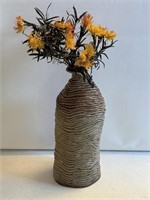 Clay vase measures 14-1/2 inches with artificial
